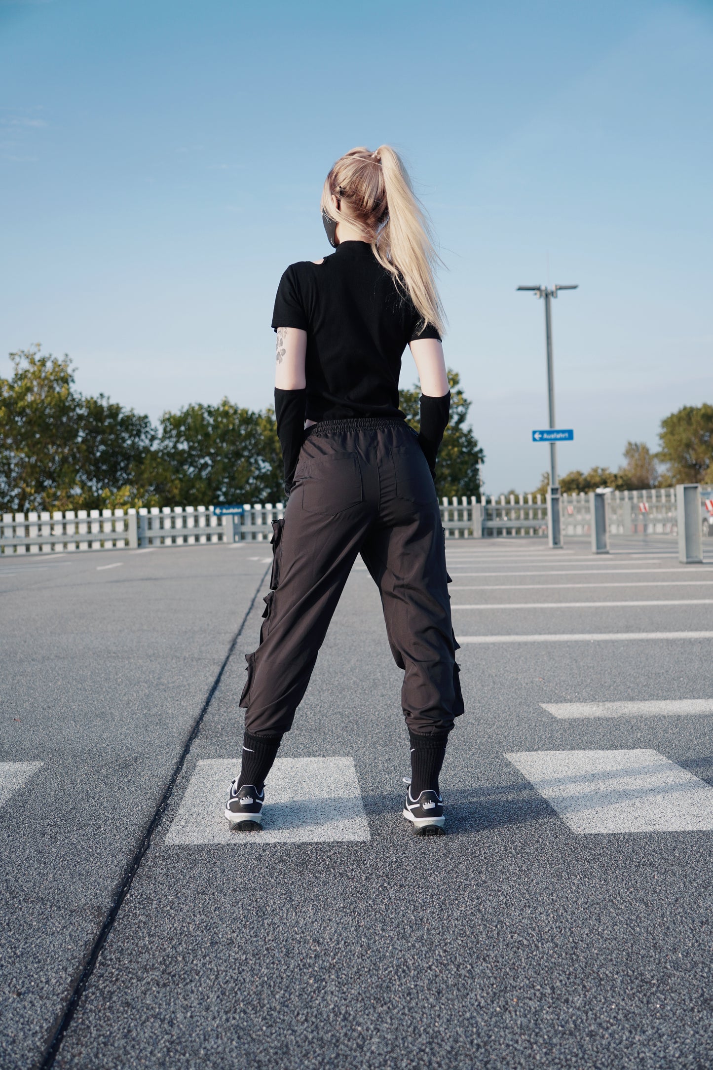 White women wearing a techwear styled Body Suit Top Set in color Black