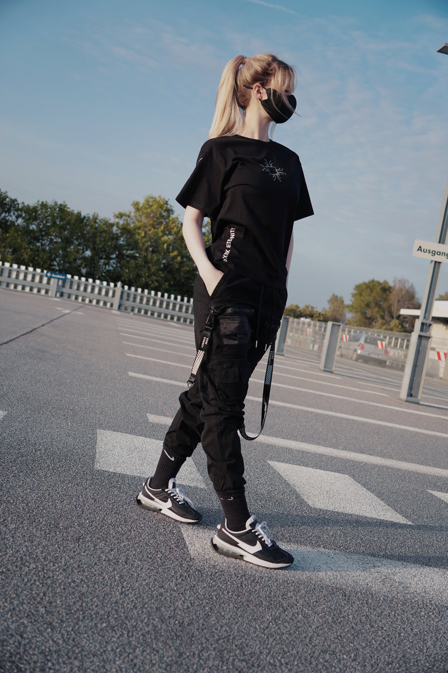 White women wearing Techwear styled Pants with 4 pockets, 2 with zippers 2 normal 