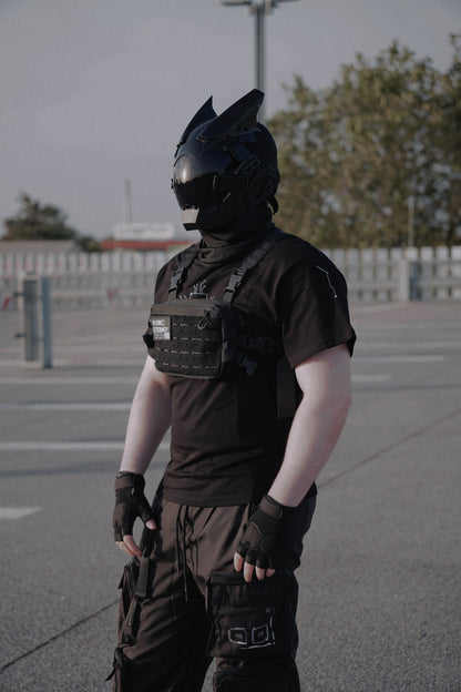 White women wearing techwear styled frontbag with patch attached to the front with Dxrk Eternity Logo